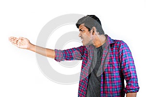 Young Man Making an Angry Gesture a Plain Background