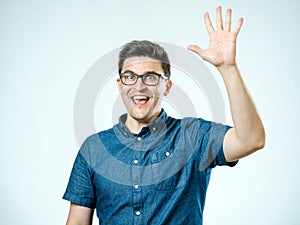 Young man making high five gesture