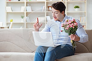 The young man making marriage proposal over internet laptop