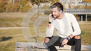 Young man making phone call outdoor in city