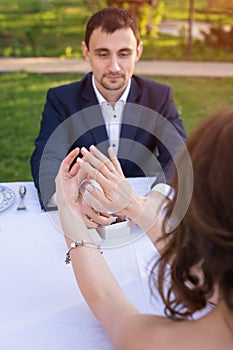 Young man making a proposal of marriage. Love, couple, date, wedding concept.