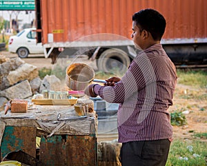 A young man making a tea