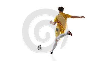 Young man, male soccer football player training isolated on white background.