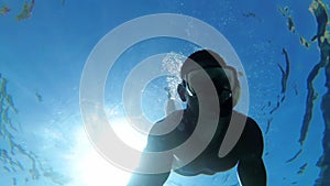 Young Man in a Mask with Snorkel, Dive in the Clear Water of the Red Sea