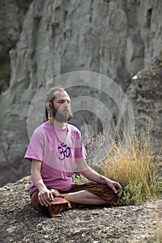 Young Man Meditating Outdoors