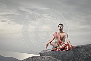 Young man meditating