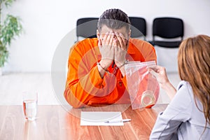 Young man meeting with advocate in pre-trial detention