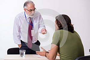 Young man meeting with advocate in pre-trial detention