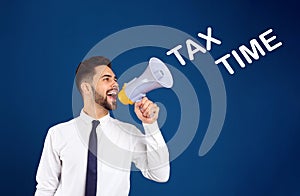 Young man with megaphone and text TAX TIME on background