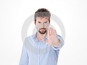 Young man with miking stop with his hand