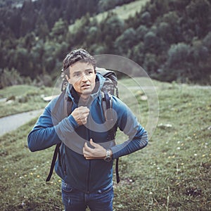 Young man in the mountains during an outdoor advernture photo