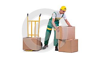 The young man moving boxes with cart isolated on white