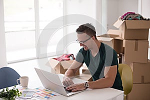 Young man moving in a new home