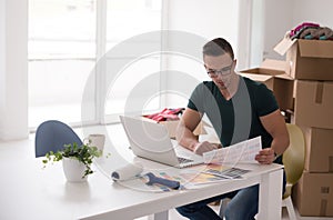 Young man moving in a new home