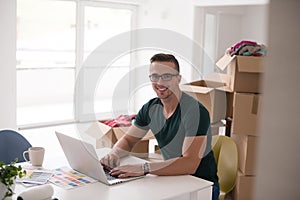 Young man moving in a new home