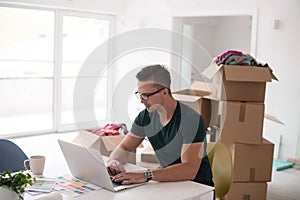 Young man moving in a new home