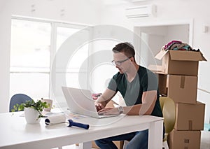 Young man moving in a new home