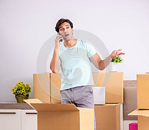 Young man moving to new apartment