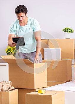 Young man moving to new apartment