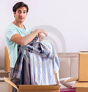 Young man moving to new apartment