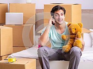 Young man moving to new apartment
