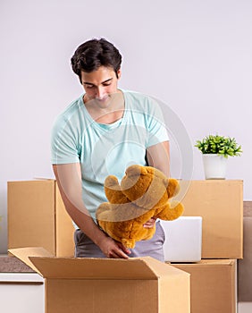 Young man moving to new apartment