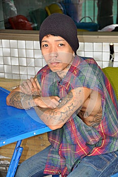 Young Man with Multiple Tattoos