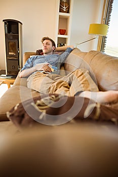 Young man napping on his couch