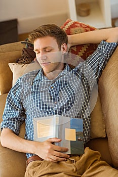 Young man napping on his couch