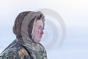 Young man, in the national winter clothes of the northern inhabitants of the tundra, the Arctic circle