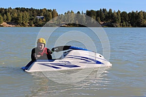 Young man near his jet ski.