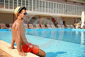 Young man near pool