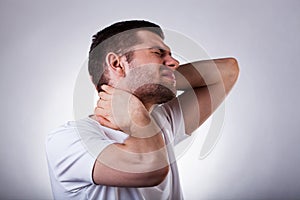 Young man with neck ache