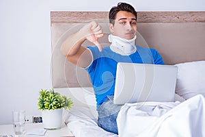 The young man with neck injury in the bed