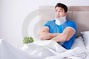 The young man with neck injury in the bed