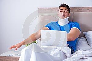 The young man with neck injury in the bed