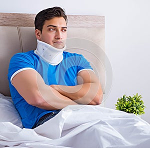 Young man with neck injury in the bed