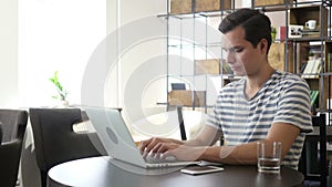 Young man with notebook laptop working on work place, Typing, Thinking