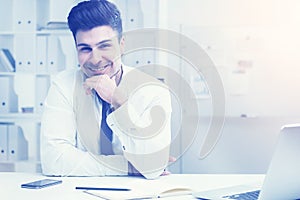 Young man at office table, toned