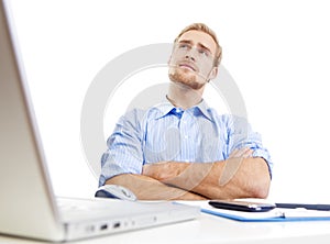 Young man at office thinking