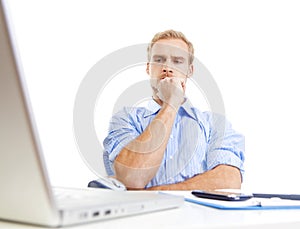 Young man at office thinking