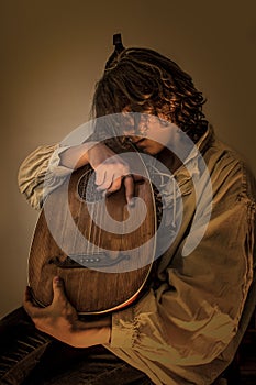 Young Man with Old Oud Guitar Lute