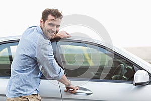 Young man opening the door