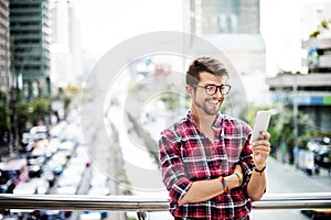 Young Man Outdoors Browsing Smartphone Concept