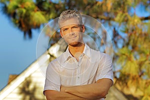 Young man outside house