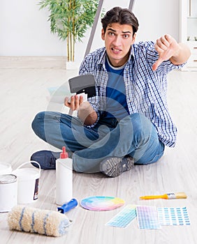 Young man overspending his budget in refurbishment project