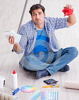 Young man overspending his budget in refurbishment project