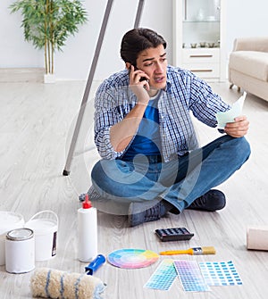 Young man overspending his budget in refurbishment project