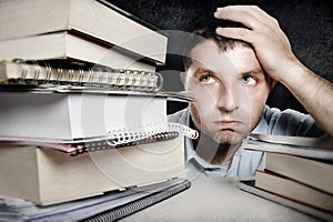 Young Man Overwhelmed and frustrated in education stress concept