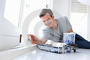 Young man painting home